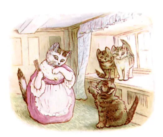 こねこの毛をとかすおかあさん